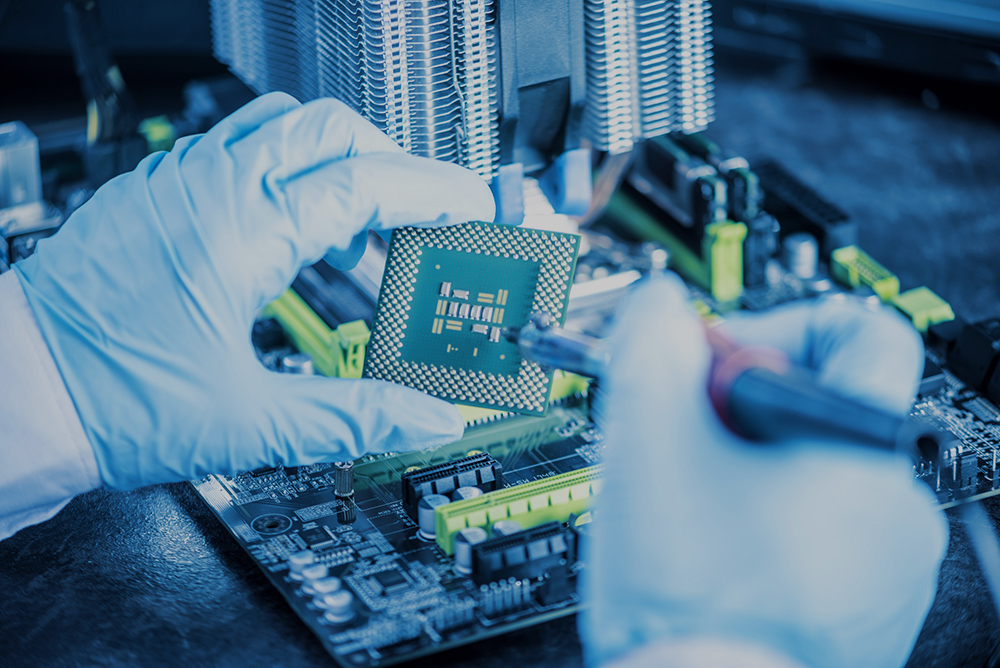 Engineer technician computers in gloves on the hands is reviewing the failure. Concept of repair microchip